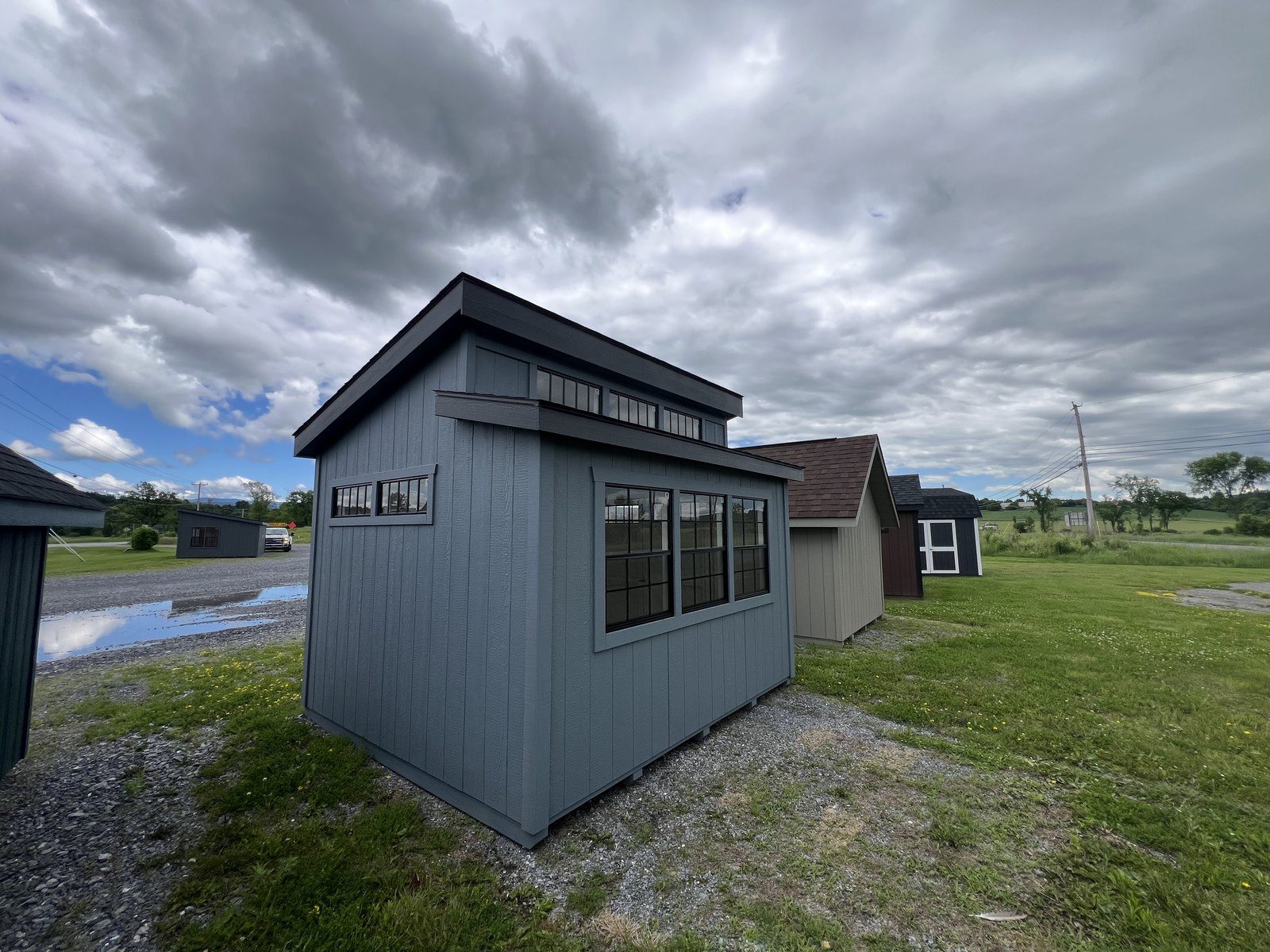 Ridgeview Studio Lean To shed side exterior with dark siding