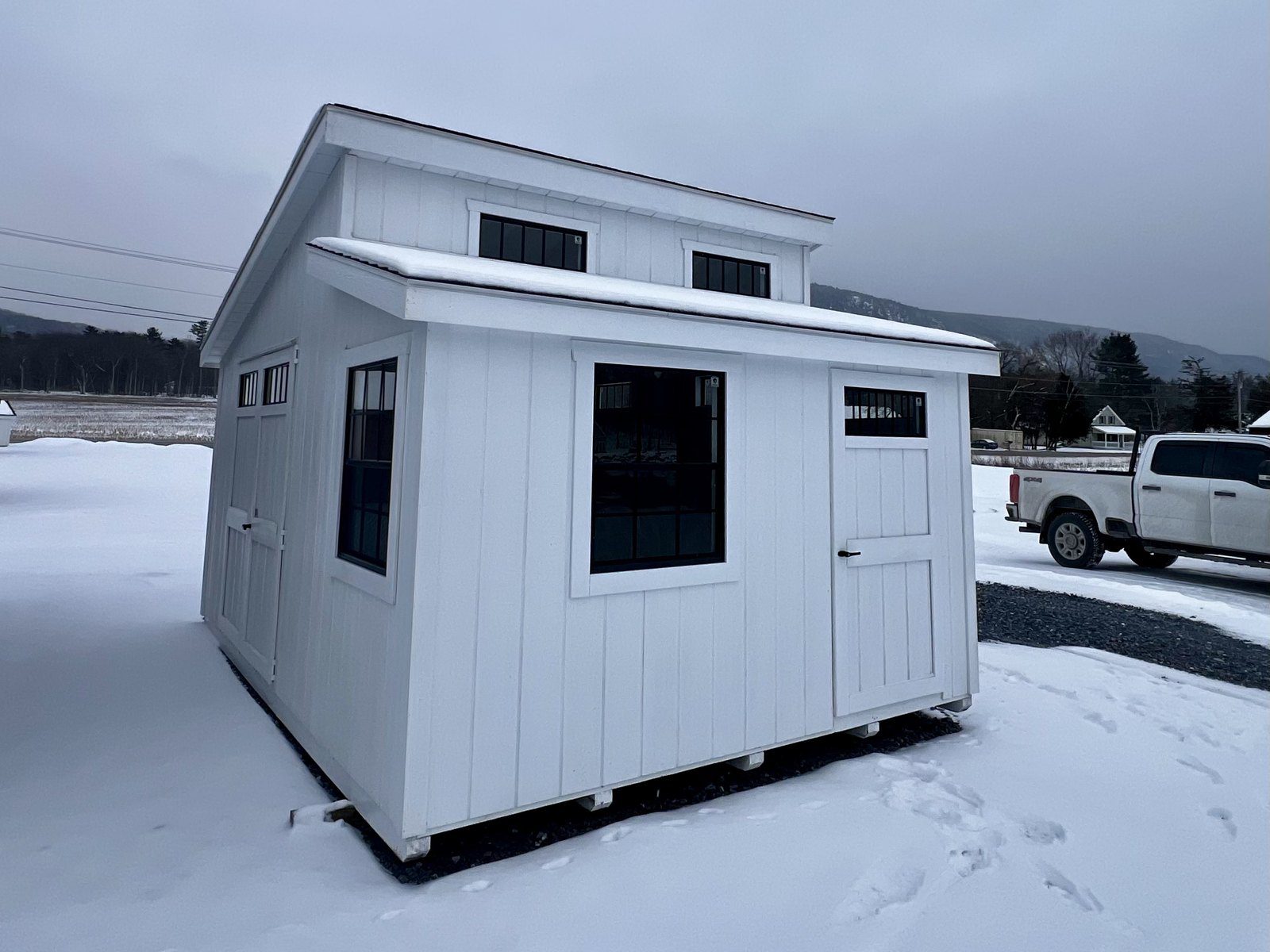 Ridgeview Studio Lean To shed exterior in winter setting