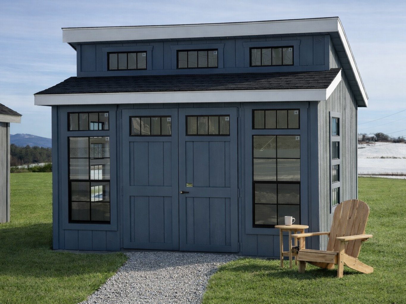 Ridgeview Studio Lean To shed concept with blue siding and glass doors