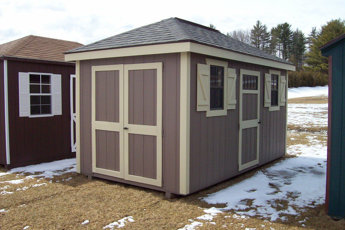 Colonial Hip Roof Shed with 6-inch roof overhang and Z-style shutters