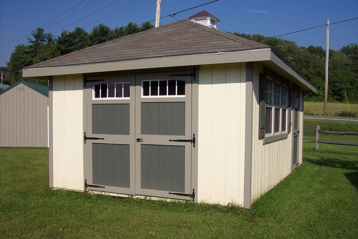Victorian Hip Roof Shed exterior with 12-inch roof overhang and Z-style shutters